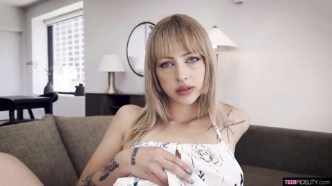 Blonde babe Jade Jaxx in low-cut white dress showing cleavage