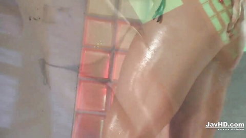 Shelby Wakatsuki in erotic green bikini, oiled skin and teasing pose