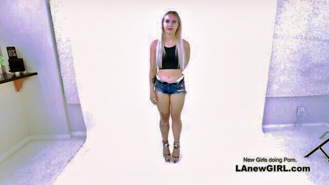 Blonde teen model in tiny denim shorts bralette and high heels posing for porn casting audition