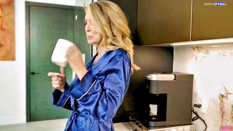 Gigi Dior blonde MILF in sexy blue satin robe, teasing big tits in kitchen