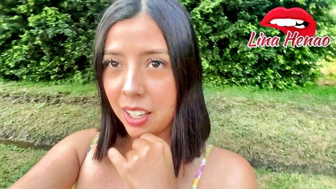 Lina Henao smiling teasingly in yellow top, outdoor deepthroat preview