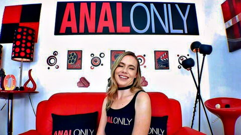 Rebel Rhyder smiling in tight Anal Only tank top, blonde bombshell ready for anal play