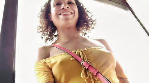 Gia smiling with deep cleavage in sexy yellow off-shoulder top