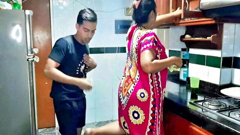Diana Prince teasing stepson in colorful dress in kitchen