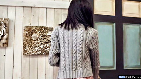 Scarlett pregnant model in gray cable-knit sweater, back view