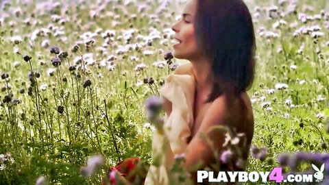 Miky Muse nude in flower field, sensual pose with white cloth