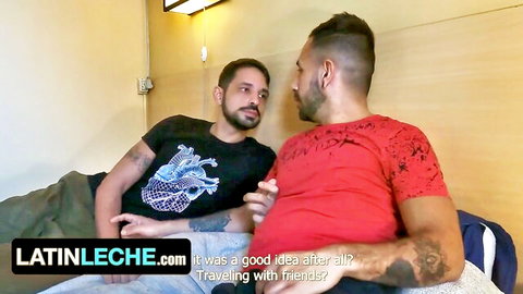 Two hot Latin guys in shirts chatting on vacation bed, swinger fun