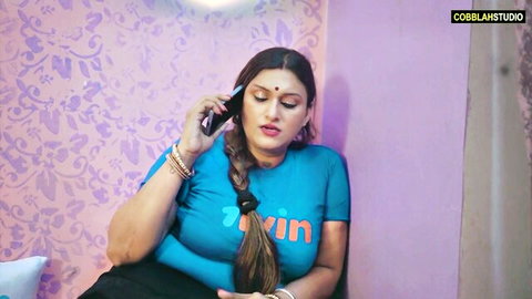 Indian MILF with big boobs in blue top on phone call