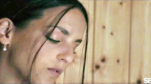 Seductive brunette's intense close-up in steamy adult scene