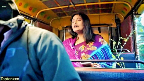 Indian model Trahultakla in colorful saree smiling seductively in rickshaw with driver