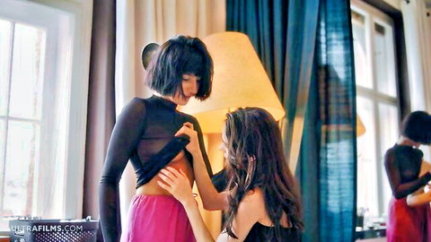 Leona Mia and Sarah Heizel intimately touching in sheer lingerie