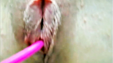 Close-up of tight shaved pussy with pink toy insertion