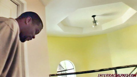 Handsome black man in casual shirt looking thoughtful indoors
