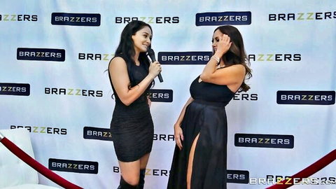 Ava Addams in tight black dress at Brazzers event with another model