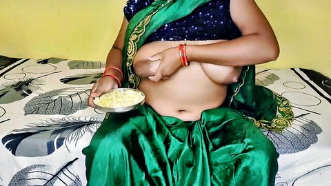 Hot Mallu bhabhi topless in green sari, exposing curves and holding poha