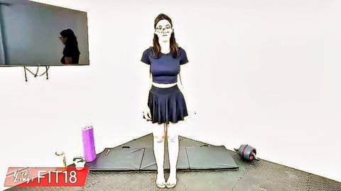 Ellie Nova standing in blue skirt and top for casting couch audition