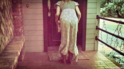 Skinny blonde teen in sheer dress bending at door teasing small ass from behind