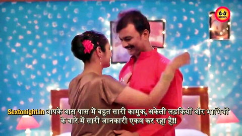 Clothed Indian couple passionately embracing in steamy bedroom foreplay