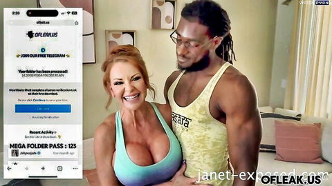 Busty redhead MILF with massive tits in turquoise top smiles embracing muscular black stud in tank top