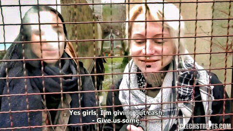 Two Czech girls smiling behind fence for cash in street POV threesome teaser
