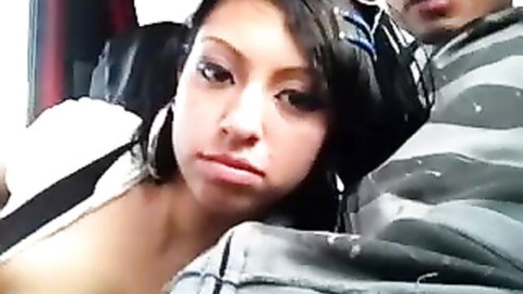 Stunning Asian babe giving naughty car blowjob to partner