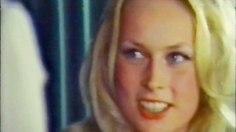 Vintage blonde smiling seductively in white top from classic hairy pussy XXX
