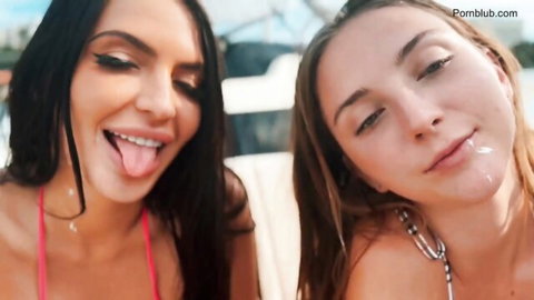 Two sexy brunettes in bikinis on boat, playful tongues and cumshot tease