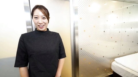 Smiling Japanese mature woman in black collared top, JAV preview