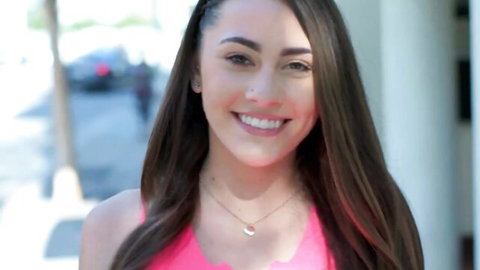 Mackenzie Mace smiling in pink tank top outdoors