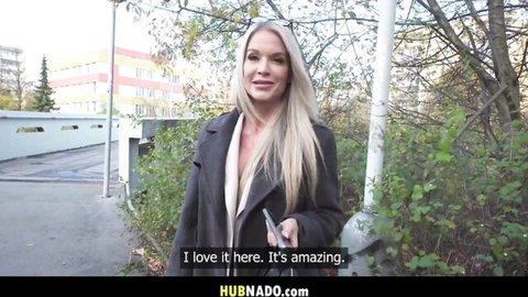 Blonde bombshell Cherie DeVille teases outdoors with deep cleavage