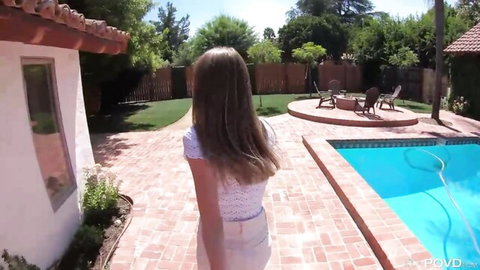 Petite long-haired brunette teen in tight white shorts walks her small ass to backyard pool