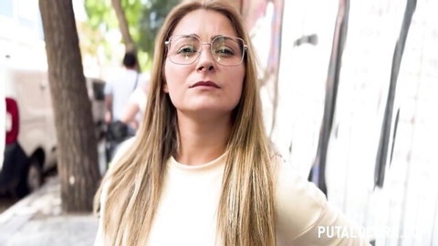 Blonde MILF with glasses in tight white top stands on street for public pickup