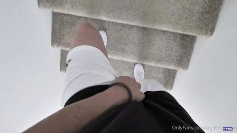 Crystal Clark in tight white shorts and sneakers, POV leg view on stairs