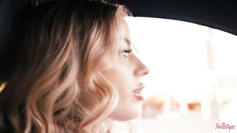 Laney Grey seductive profile in car window, blonde waves, Twistys teaser