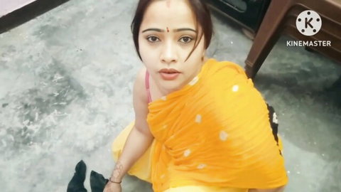 Sexy Desi Bhabhi in yellow saree sitting seductively