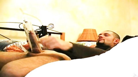 Submissive bald man dominated in bondage sucking big dildo