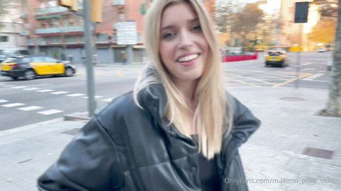 Freya Mayer smiling on Barcelona street in black leather jacket