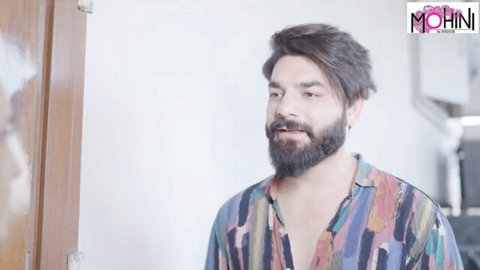 Bearded Indian man Mohinibob in colorful open shirt, Mohini watermark