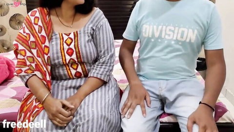Indian MILF in salwar kameez sits with young guy on bed in Hindi XXX