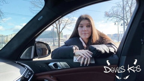 Stefany Kyler smiling from luxury car window in Devils Kiss outdoor tease