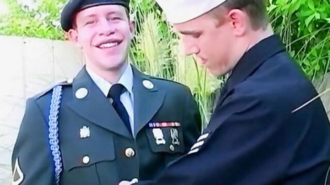 Two fit white soldiers in army and navy uniforms embracing closely, military uniform fetish