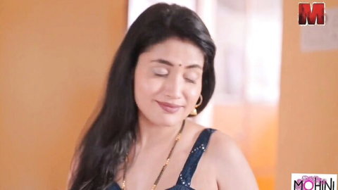 Mohinilaxmi seductive Indian woman in black top and gold jewelry