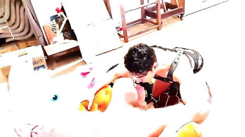 Slim Asian guy in black harness bends over naughty unicorn floaty in amateur video