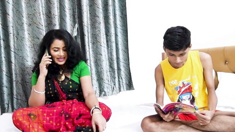 Indian stepmom in red saree on phone with stepson reading book