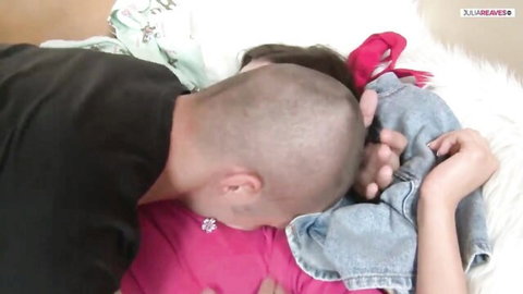 Bald man buries face in teen girl's spread pussy performing hungry cunnilingus on furry bed