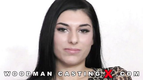 Kristal Amore in Woodman Casting, stunning brunette with dark hair in leopard print top