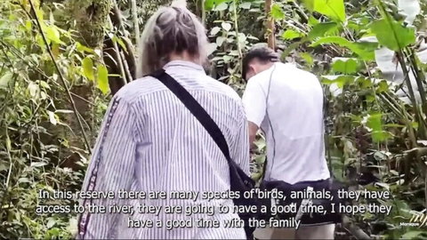 Curvy stepmom and stepson walking by river in outdoor taboo hike