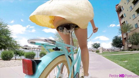 Avi Love flashes hairy pussy in yellow dress on bicycle ride