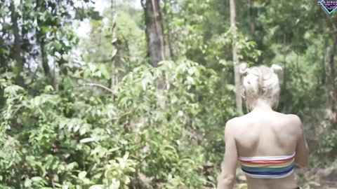 Blonde in rainbow bikini teases forest blowjob adventure