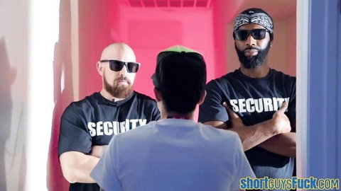 Two muscular security guards confront short guy in hallway on shortguysfuck